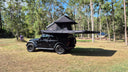 Four wheel drive with an On The Horizon rooftop tent and 270 degree awning set up in bush