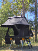 On The Horizon 1.4 hard shell rooftop tent pitched on stands in open bushland