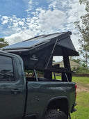 On The Horizon 1.4X hard shell rooftop tent open on a ute against a clear sky