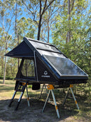 On The Horizon 1.4 rooftop tent open on freestanding legs with the solar panel facing up