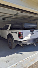 A ute with the 1.5 Pro closed, parked under a roller door