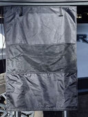 Close up of the hanging gear bag and its three compartments