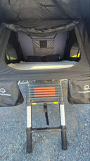 Close view of the 1.9 Penthouse rear opening, the mattress, the telescopic ladder and the two gear bags