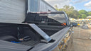 Rack arm foot mounted to the Silverado 1500 tub rail
